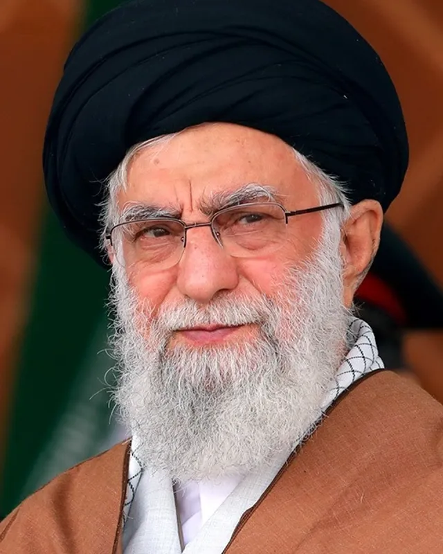 Portrait photograph of Ali Khamenei in a black turban and robe.
