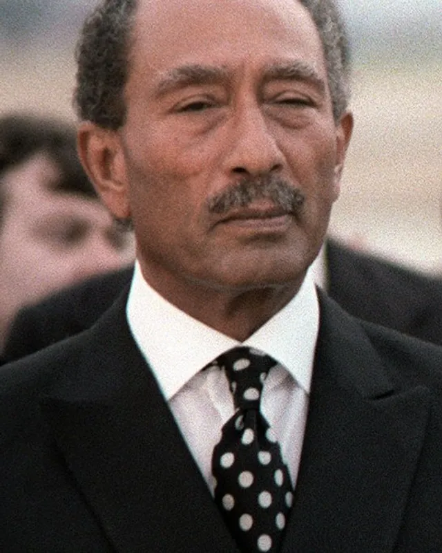 Photographic portrait of Anwar Sadat in a suit.