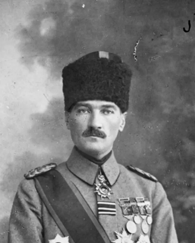Portrait photograph of Mustafa Kemal Atatürk in formal dress.