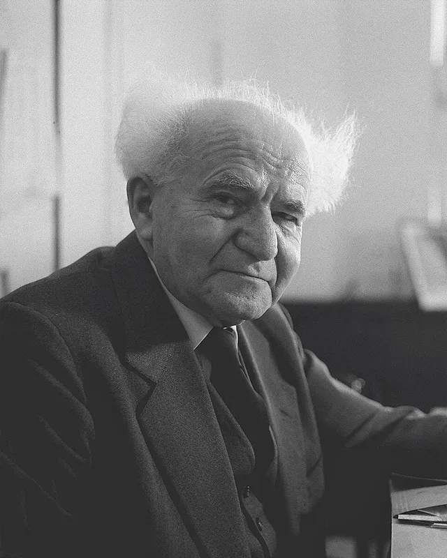 Photograph of David Ben-Gurion seated at a desk.