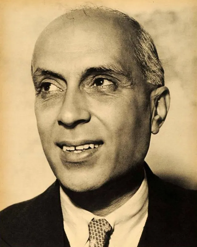 Portrait photograph of Jawaharlal Nehru in 1942, in a buttoned jacket and cap.