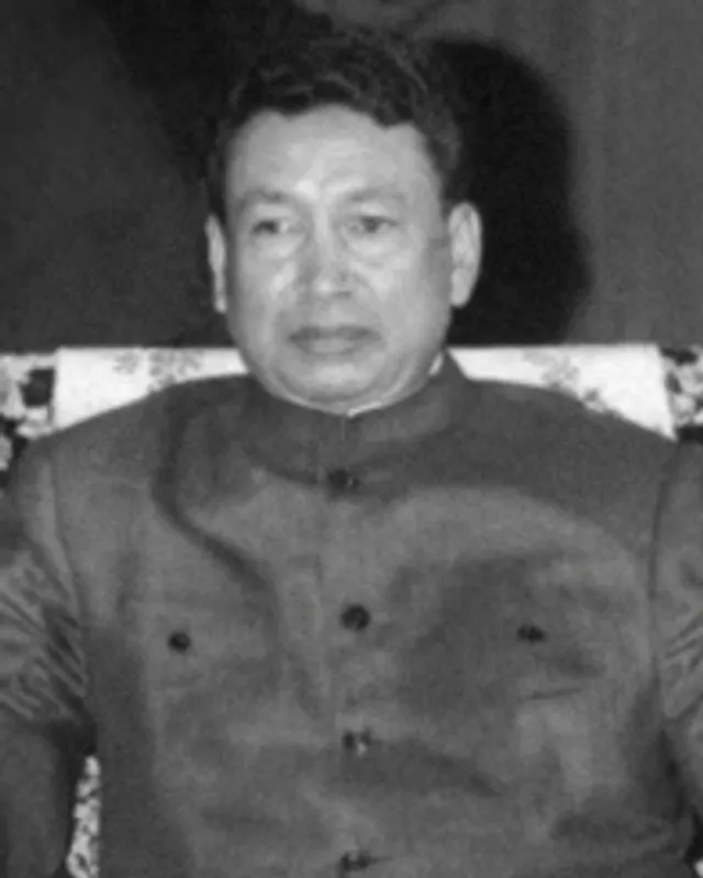 Photograph of Pol Pot in a dark jacket.