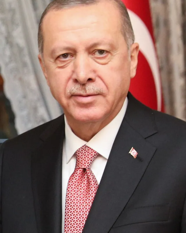 Photograph of Recep Tayyip Erdoğan in a dark suit.