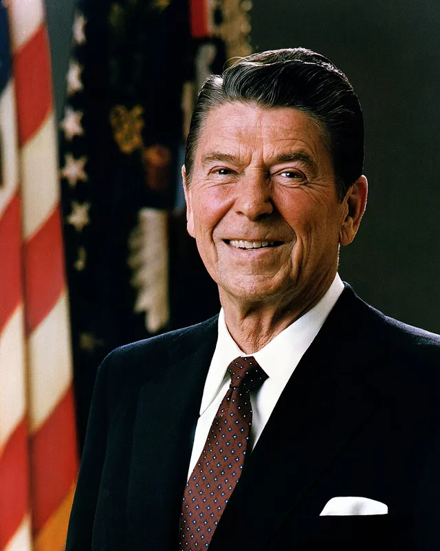 Official 1981 presidential portrait of Ronald Reagan in a dark suit and red tie.