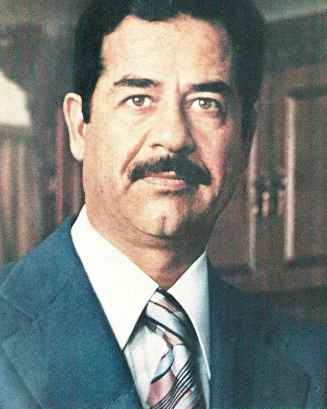 Photographic portrait of Saddam Hussein in a suit, 1979.