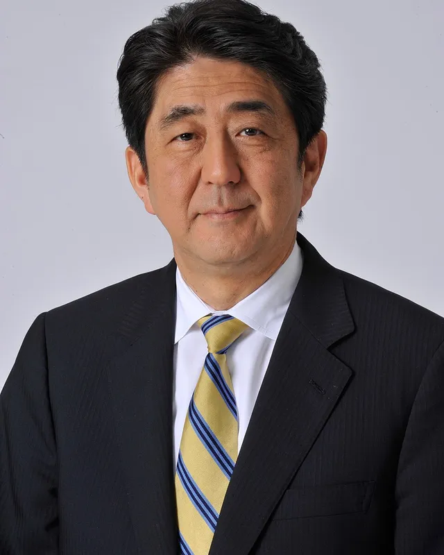 Photographic portrait of Shinzo Abe in a suit.
