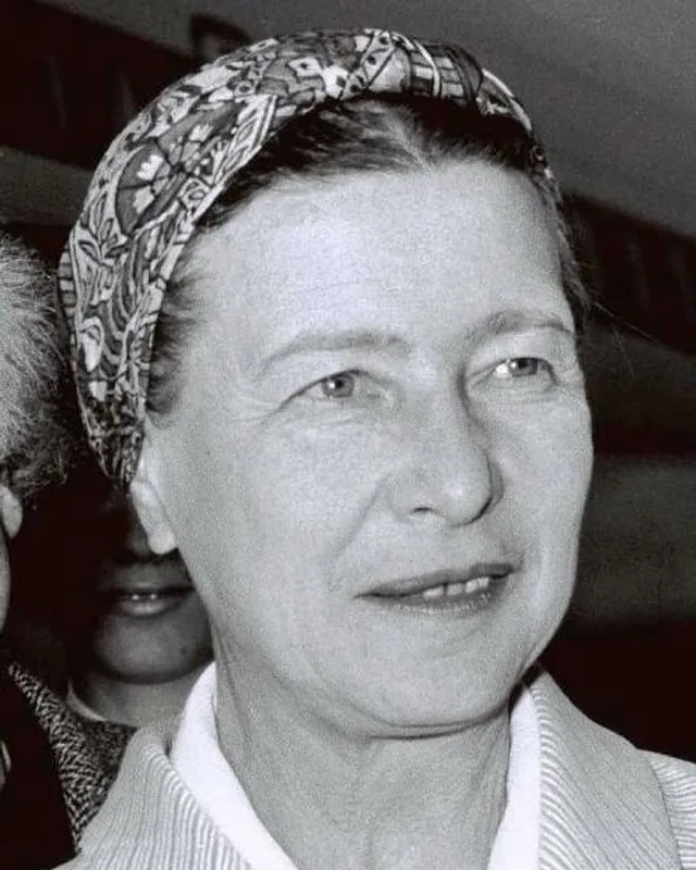 Photograph of Simone de Beauvoir wearing a patterned headscarf.